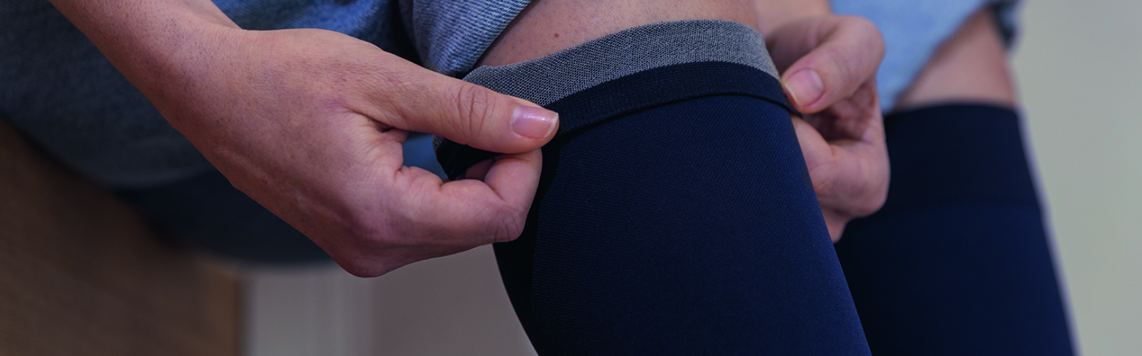 Closeup of a person wearing JOBST SoftFit stockings Closeup of a person wearing JOBST SoftFit stockings